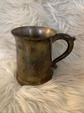 Solid brass mug, ~12 oz / 1.5 cup capacity 
Gatco is maker
Approximately 5” x 3”